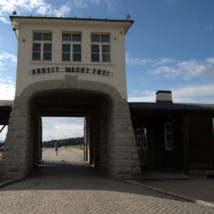 Upon the entrance of concentration camp says, arbeit macht frei -- "Work Makes You Free"